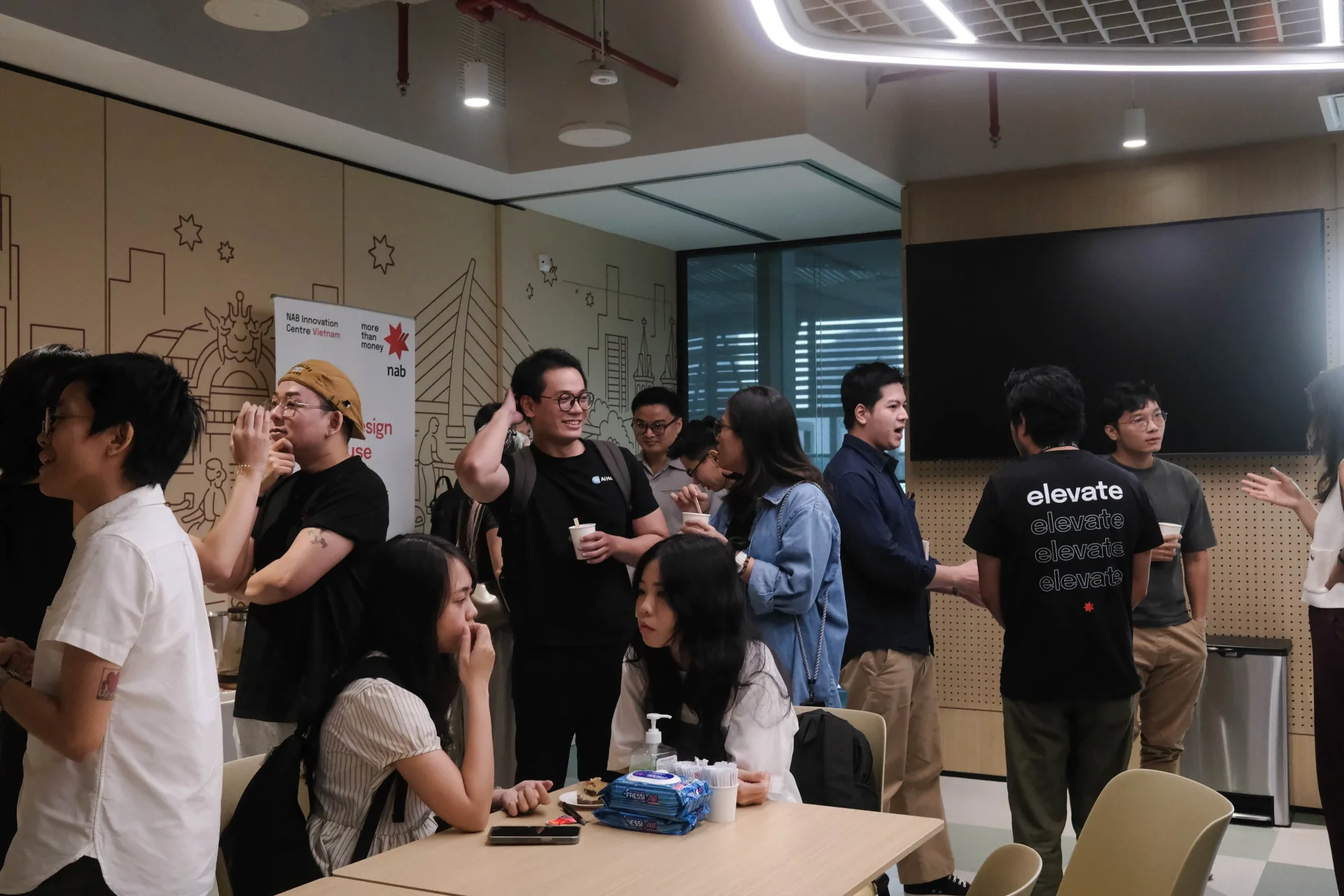 Toan Nguyen at a Product Design Open House, chatting and connecting with the designer community in the event space.